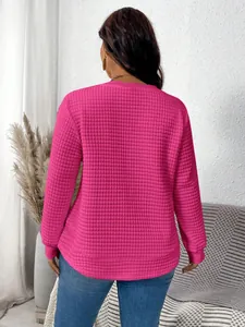 Back view of a hot pink women's textured waffle knit sweatshirt with grid pattern