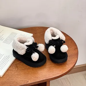Cozy black toddler snow boots with soft white plush fur lining and cute pom-poms detail