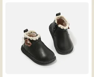 Schwarze Lauflernschuhe für Baby Mädchen mit gestricktem Rüschenkragen