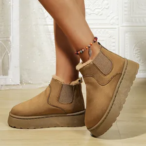 Detailed view showing warm tan plush-lined snow boots with stylish thick platform soles.