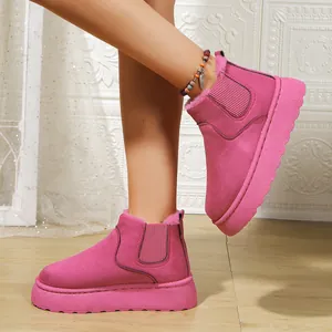 Side detail view of vibrant pink platform snow boots with warm faux fur lining for women