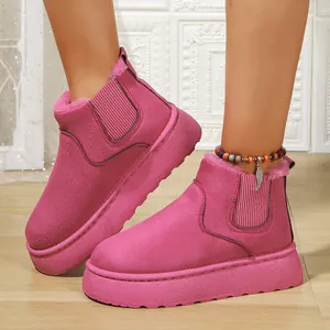 Detailed view of women's bright pink platform snow boots with plush faux fur lining for winter
