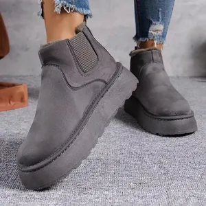 Grey thick platform snow boots with warm faux fur lining and side elastic panel.