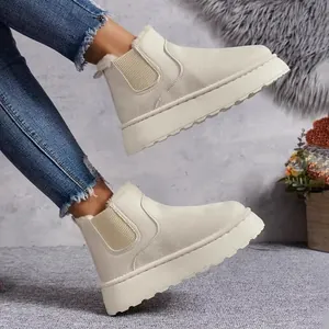 Detailed side view of beige thick-soled snow boots with warm faux fur lining.
