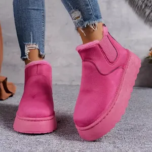 Vibrant pink platform snow boots featuring thick fleece lining and durable suede finish