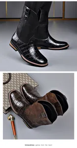 Detailed view of brown western cowboy boots with crocodile texture and embroidery fine