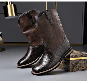 Vintage brown men's western cowboy boots with embroidered details and crocodile texture