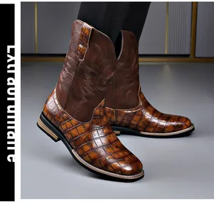 Close-up of brown crocodile embossed men's western cowboy boots with embroidered shaft