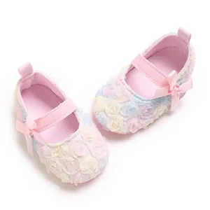 Close-up of pastel 3D floral lace and pink bow details on cute baby Mary Jane shoes