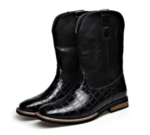 Black men's cowboy boots featuring intricate embroidery and crocodile pattern texture.