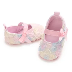 Soft pink baby Mary Jane shoes with colorful floral lace and delicate bow detail