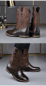 Detailed view of vintage brown cowboy boots featuring crocodile skin pattern and embroidery