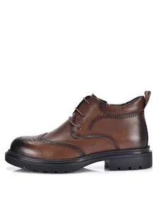 Premium brown leather men's brogue ankle boots with durable thick rubber soles for winter.