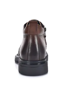 Rear view of premium brown cowhide leather men's Martin boots with durable rubber sole.