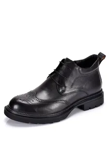 Detailed side view of men's black leather Martin boots featuring brogue wingtip design