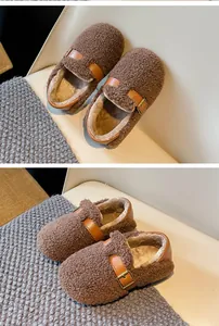 Detailed view of warm brown fleece wool shoes for girls featuring buckle straps.