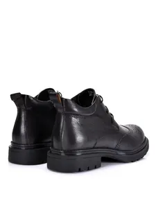 Detailed rear view of black leather brogue boots for men with durable soles