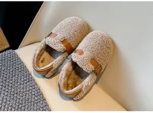 Detailed view of warm children's beige shearling loafers with brown leather strap