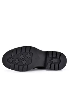 Durable rubber sole detail of men's leather boots with anti-slip patterns