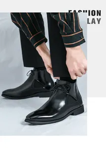 Close-up of stylish men's black shiny leather Chelsea boots in a classic design