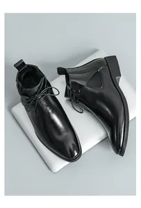 Top view detail of black polished leather Chelsea boots for men in classic British style