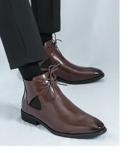 Detailed view of stylish brown leather Chelsea boots for men with lace-up accents