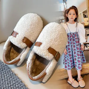 Cozy cream sherpa fleece girls' warm winter shoes featuring stylish brown buckle straps