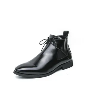 Detail of men's sleek black leather Chelsea boot with laces and side zipper closure.