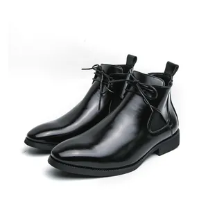 Detailed view of glossy black leather men's Chelsea boots with elegant lace-up design