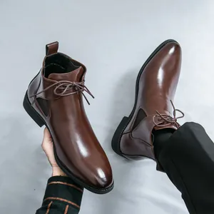 Classic British style men's brown leather Chelsea boots with polished finish and laces