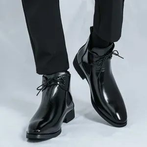 Men's polished black Chelsea boots featuring laces and a stylish British design for gentleman