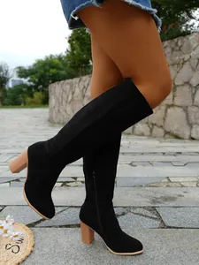 Stylish black suede knee-high boots with chunky block heels and convenient side zipper