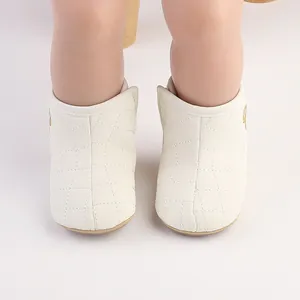 Front view of white quilted baby winter boots with warm fleece lining for newborns