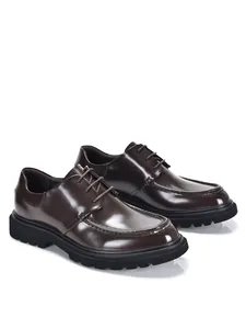 Side view of premium dark brown glossy genuine leather Derby shoes with thick lug soles.
