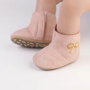 Pink quilted baby walking boots with gold bow embroidery detail