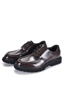 Close-up of shiny dark brown leather Derby shoes with thick soles for formal wear.