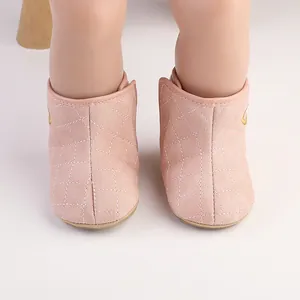 Close-up view of pink quilted baby winter boots featuring a warm velvet lining.