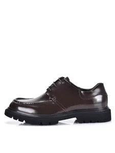 Side view of a premium brown glossy leather Derby shoe featuring a thick black lug sole.