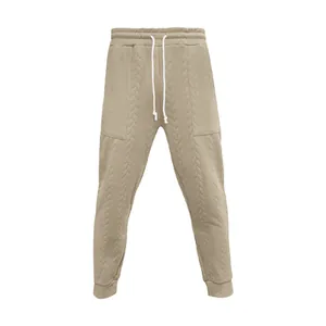 Vista detallada de pantalones de chándal jacquard caqui para hombre con cordón ajustable