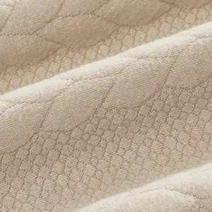 Vista macro detallada de la textura del tejido jacquard beige de tela de alta calidad