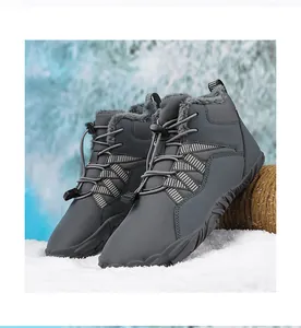 Insulated gray winter barefoot boots with warm faux fur lining on snowy ground