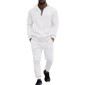 Macro detail of men's white jacquard knit tracksuit with half-zip stand collar