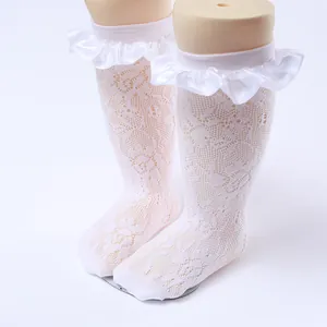 Close-up detail of white lace mesh princess socks with elegant ruffle trim for girls