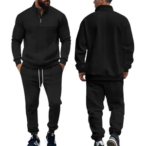Front and back view of men's black jacquard knit half-zip tracksuit set