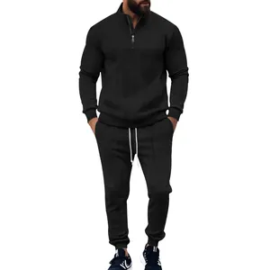Detailed view of black men's jacquard sports tracksuit set with quarter-zip top