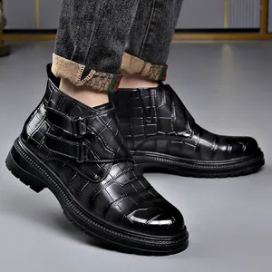 Men's black crocodile embossed leather Chelsea boots with buckle details and rubber sole
