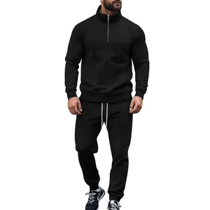 Men's two-piece black tracksuit set with jacquard texture and half-zip stand collar