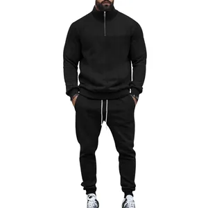 Full view of men's black jacquard two-piece tracksuit with half-zip design