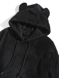 Detailed view of a soft black coral fleece hoodie featuring cute bear ears on the hood