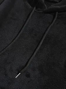 Macro view showing the soft black coral fleece texture and drawstring on men's hoodie